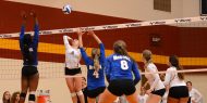 Hesston Larks volleyball player Sierrah Long goes for a kill