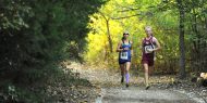 Hesston College women's cross country action photo - Sierra Broce