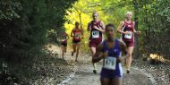 Hesston College women's cross country action photo - Sadie Winter and Renee Buckwalter