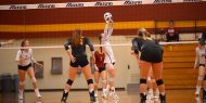 Hesston College volleyball action photo - Faith Hallmark sets in a match with Cloud County CC, Oct. 6, 2017