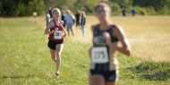 Hesston College women's cross country action photo - Sierra Broce at the Bethel College meet, Oct. 7, 2017