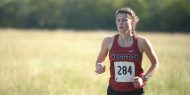 Hesston College women's cross country action photo - Liz Miler at the Bethel College meet, Oct. 7, 2017