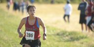 Hesston College women's cross country action photo - Sam Trejo at the Bethel College meet, Oct. 7, 2017