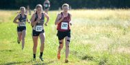 Hesston College women's cross country action photo - Sadie Winter at the Bethel College meet, Oct. 7, 2017