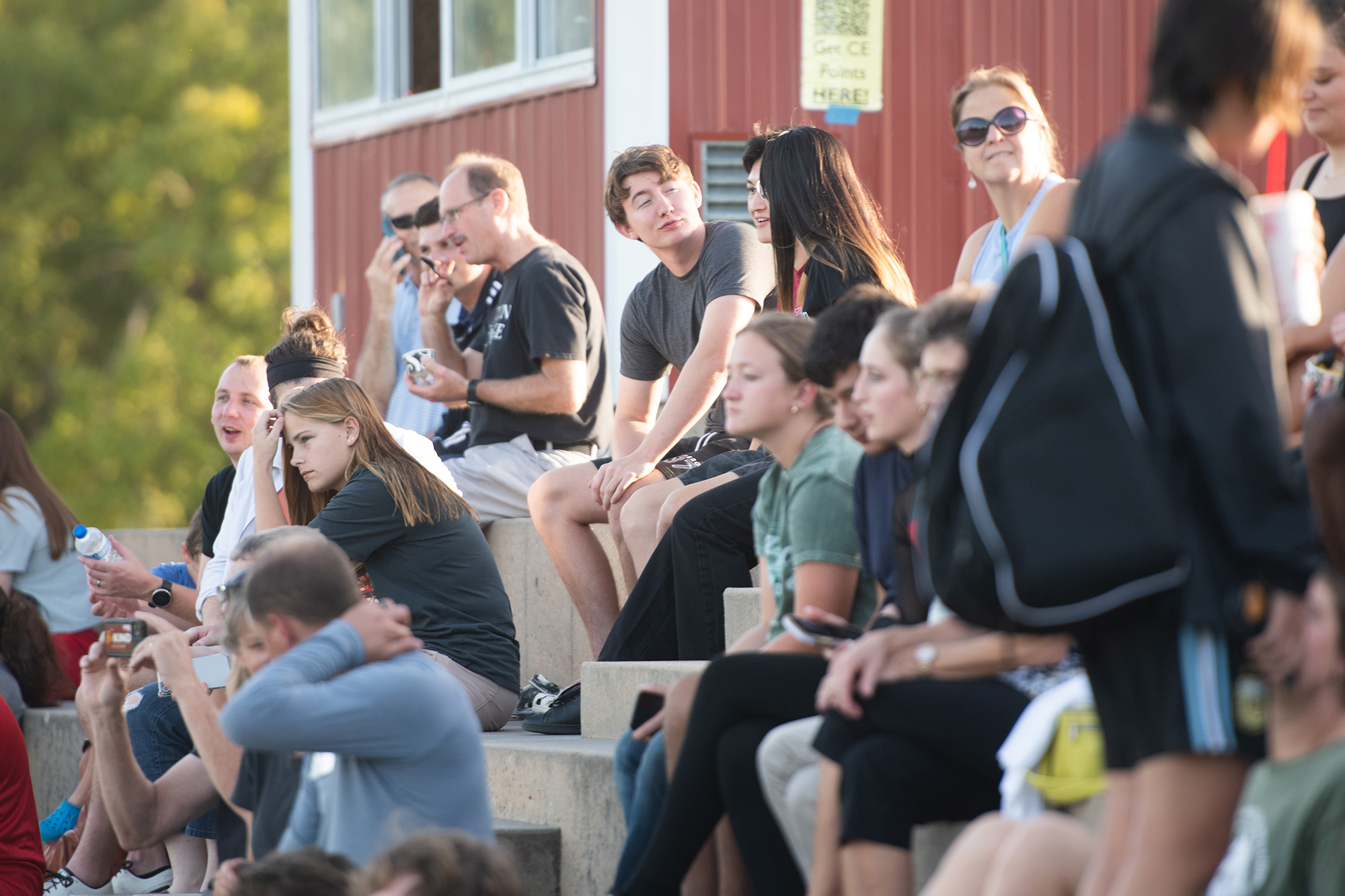 Homecoming 2024 family festival - students, alumni and fans cheer on the Lark flag football team