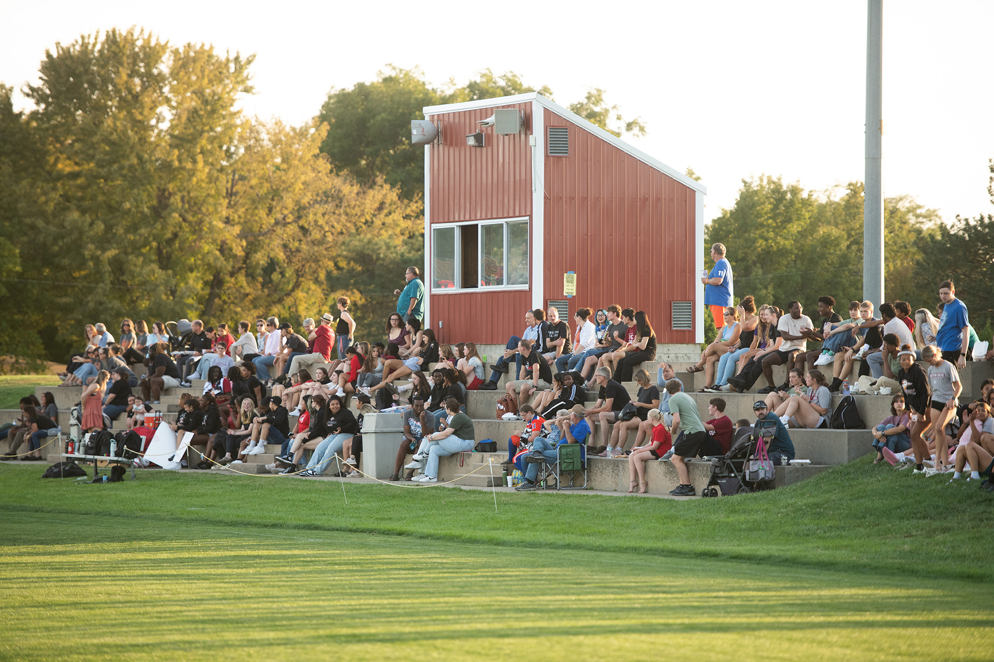 Homecoming 2024 family festival - students, alumni and fans cheer on the Lark flag football team