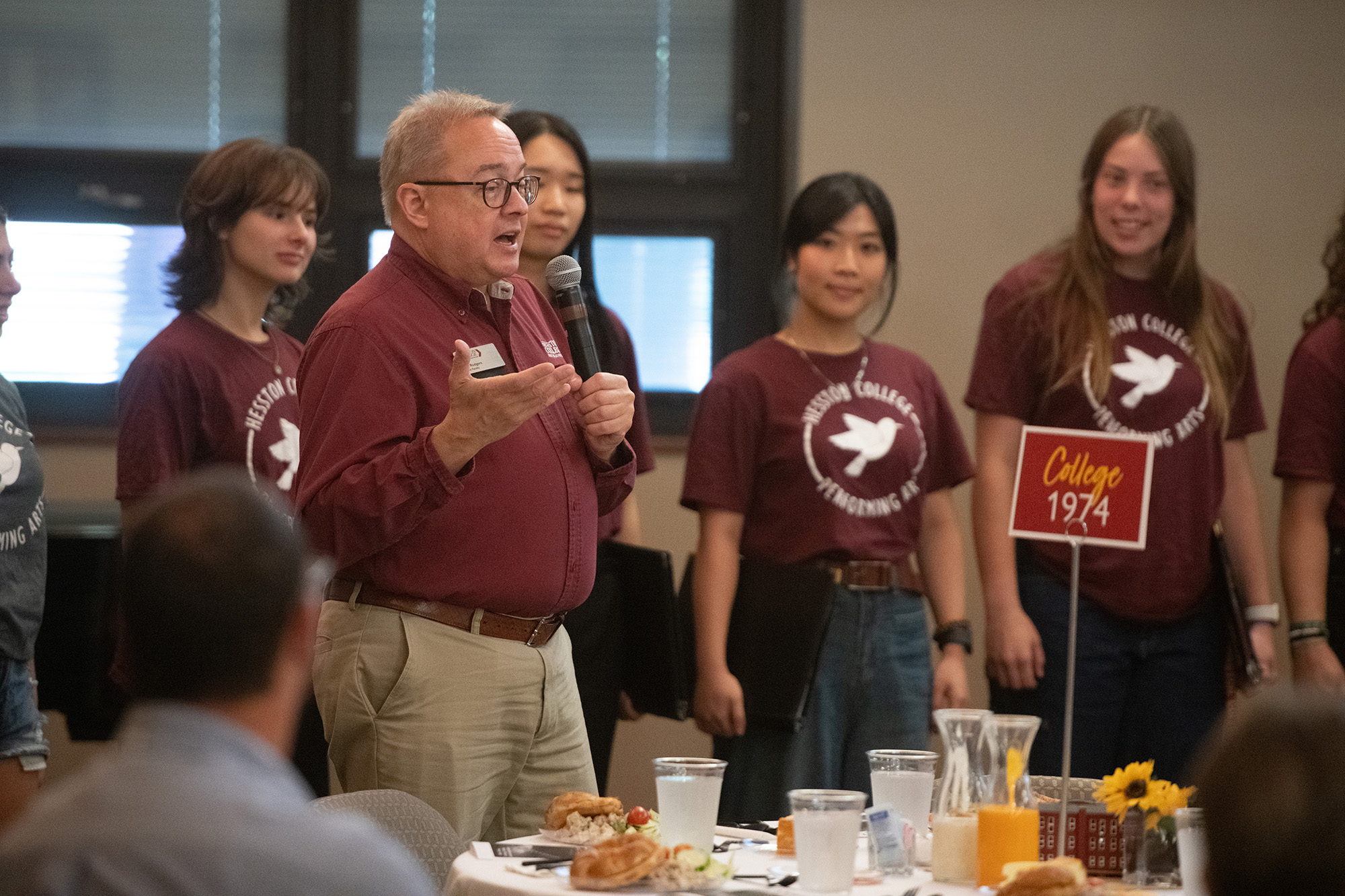 Ken Rodgers introduces the HC fight song at the Golden Gables Luncheon