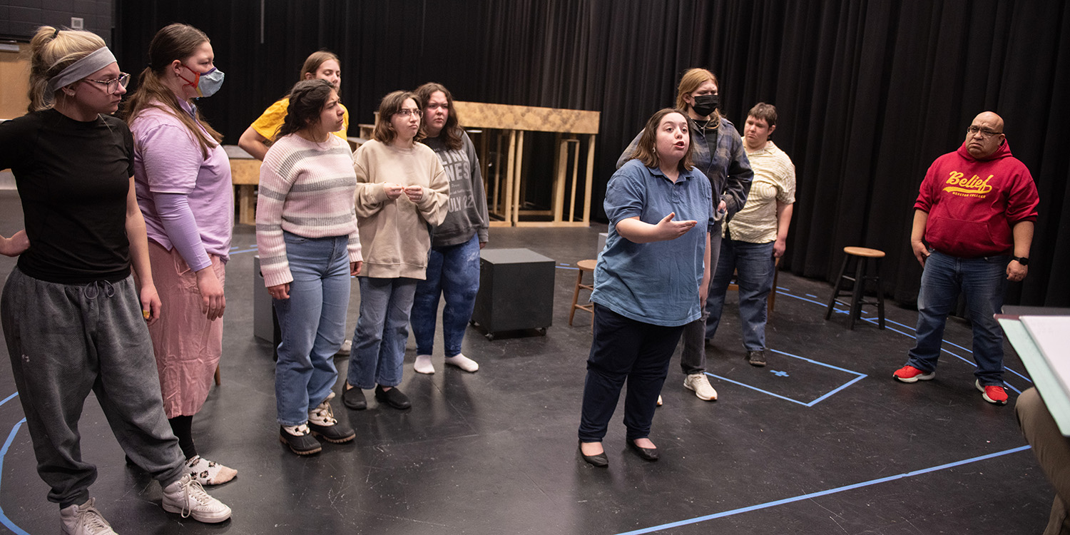 Cast members rehearse a scene for the spring 2025 Hesston College musical production, "Urinetown."